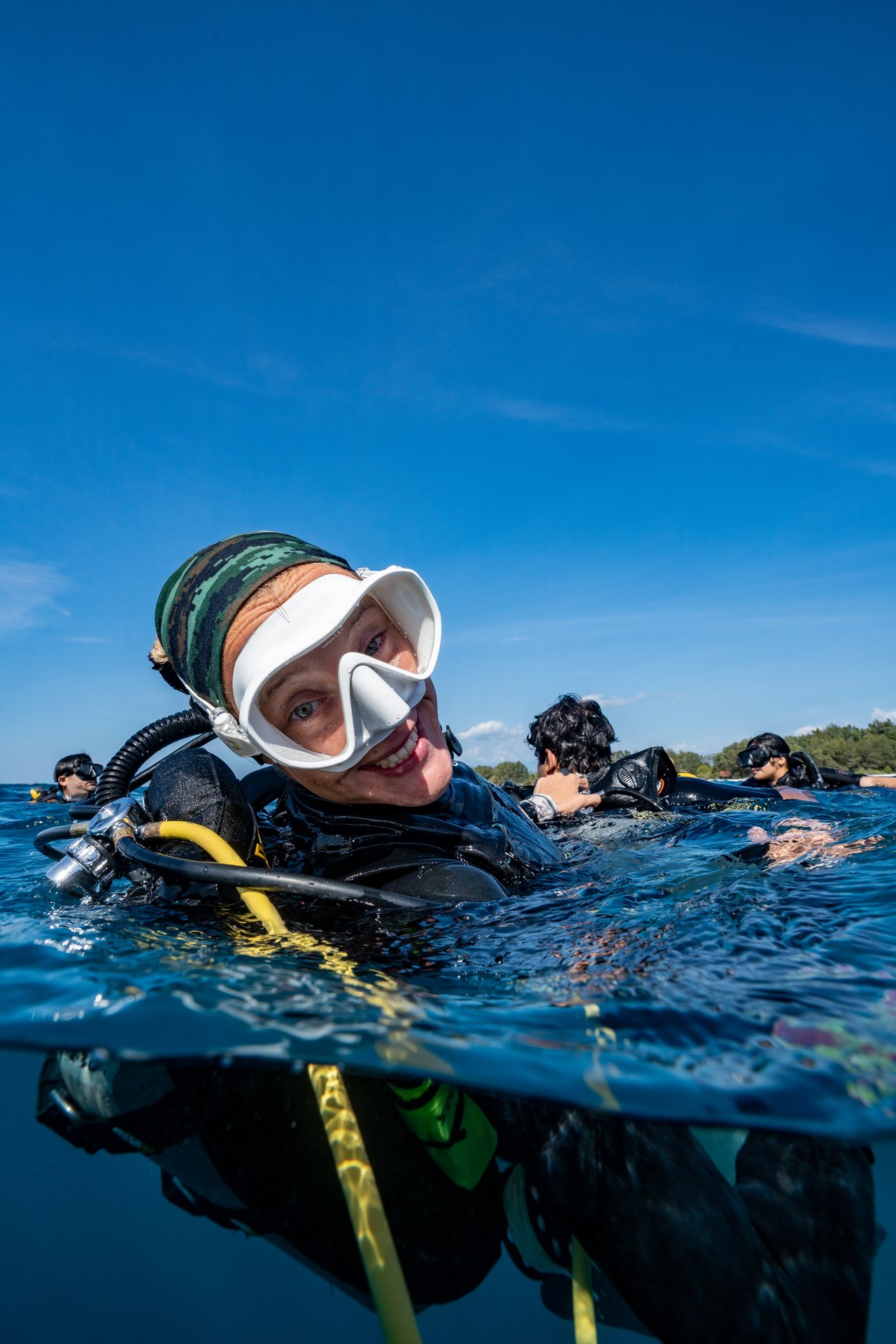 Smiling diver enjoying her first scuba experience